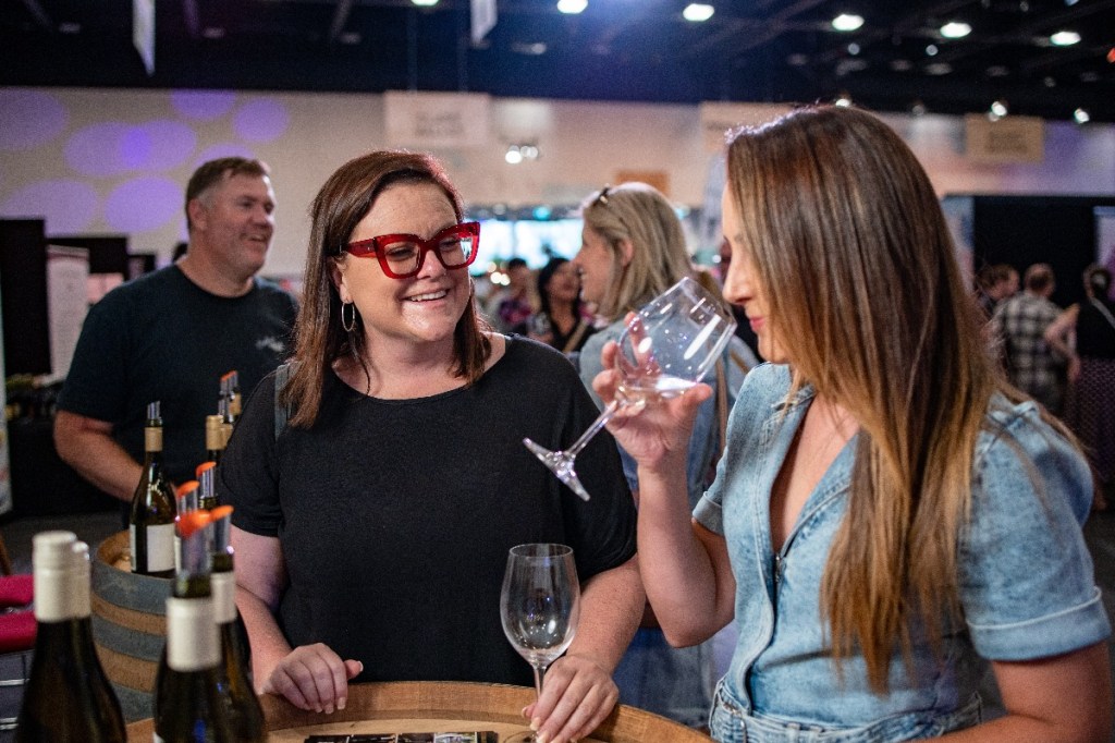 A woman smelling wine at Cellar Door Fest